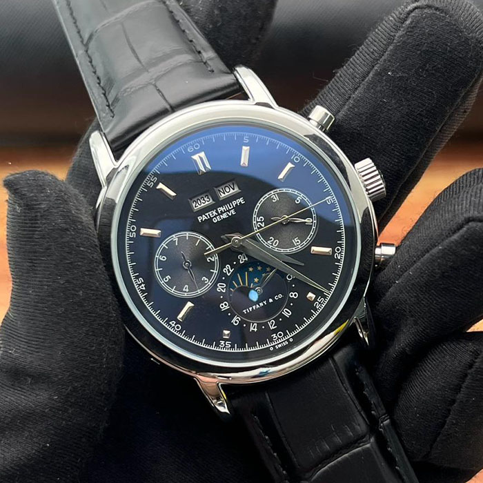 Reloj de lujo estilo Patek Philippe Geneva de 40mm, diseño automático con esfera negra multifunción y correa de piel negra.