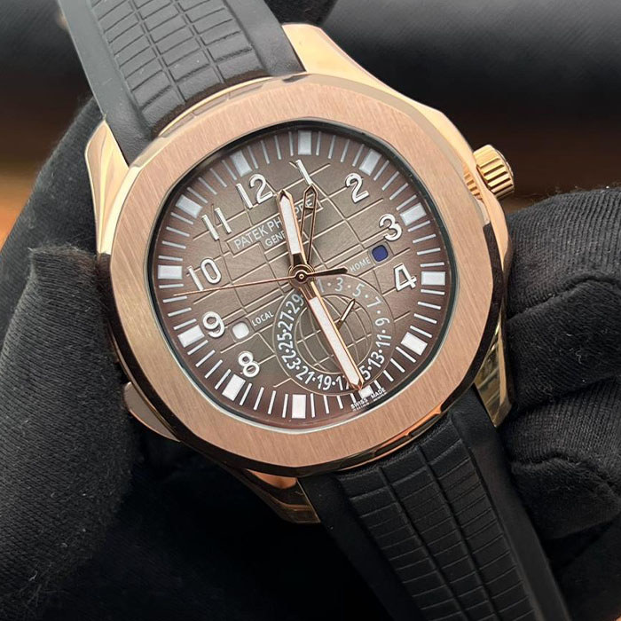 Reloj de lujo estilo Patek Philippe Geneva de 40mm, diseño automático en tono dorado con esfera marrón y correa de silicona negra.