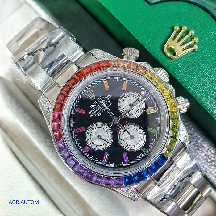 Reloj Rolex Oyster Perpetual Daytona con esfera negra, bisel multicolor y cronógrafo, ideal para quienes buscan un reloj deportivo y elegante con un diseño único.